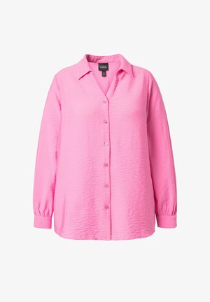 Napapaita liila kirkkaassa vaaleanpunaisessa, jossa on pehmeä, teksturoitu kangas, pitkät hihat ja klassinen kaulus nappisuljenta etupuolella.