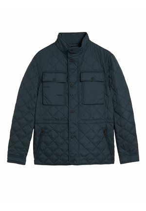 Veste matelassée foncée avec col montant, fermeture à pression devant, deux poches poitrine à rabat et deux poches latérales zippées.
