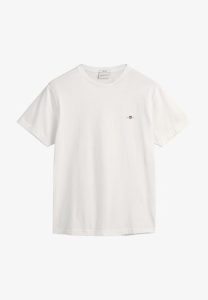 Biała bawełniana koszulka z okrągłym dekoltem i krótkimi rękawami, z małym haftowanym logo po lewej stronie klatki piersiowej. Gładka tekstura.