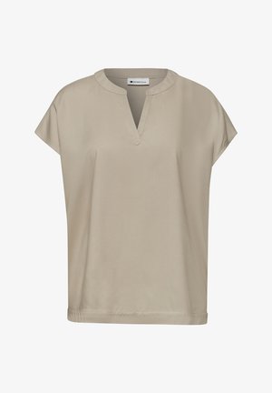 Beige lyhythihainen paita, jossa pyöreä pääntie ja pieni V-muotoinen aukko edessä, valmistettu sileästä kankaasta.