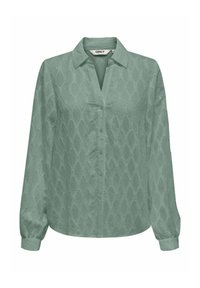 Blusa verde chiaro a maniche lunghe con collo a camicia e chiusura a bottoni. Tessuto testurizzato con un motivo a diamante in tutto il capo.