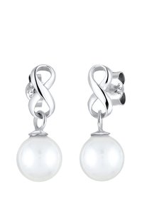 Boucles d'oreilles en argent avec un design de nœud infini, suspendant des perles de culture blanches brillantes. Les perles sont lisses et rondes, présentant une finition polie.