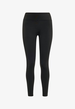 Mustad retuusid, mis on valmistatud venivast kangast, kõrge vöökoha ja voolujoonelise, kitseneva disainiga, ilma taskute või kaunistusteta.