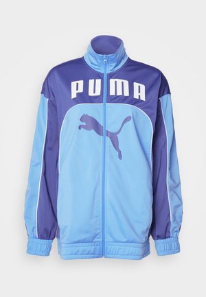Blue and purple PUMA track jacket with high collar, full zip, and elastic cuffs. Features large logo on front and side graphic of a leaping puma.