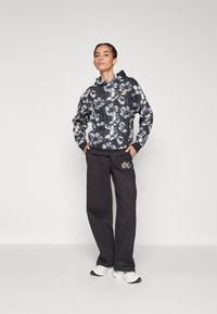 Puma CLASS ACT HOODIE  - Jersey con capucha - black