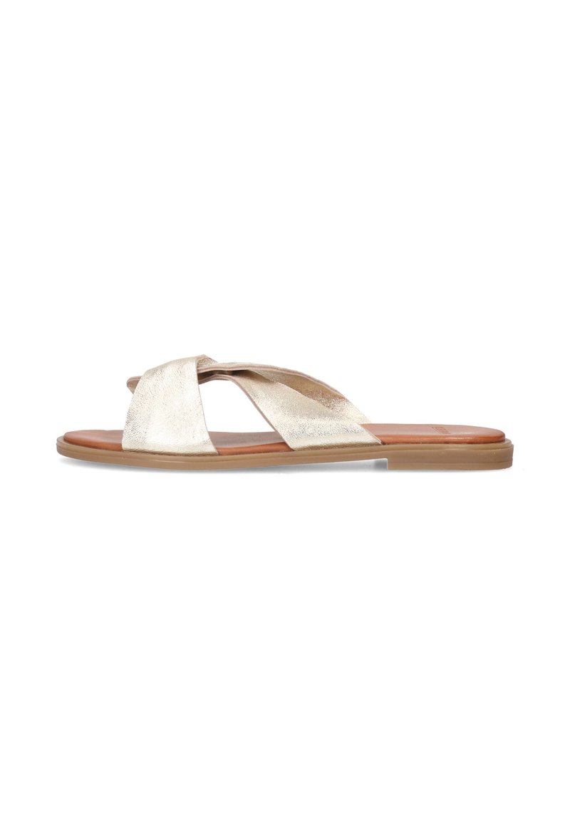 Metallic gold slip-on sandals with cross-straps, flat sole, smooth texture, and brown insole. Minimalist design suitable for casual wear.