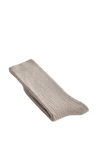 Folded beige ribbed knit sock, lying flat against white background.