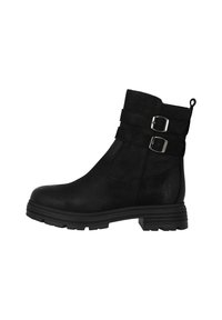 Botas negras de tobillo hechas de material sintético texturizado. Cuenta con dos hebillas ajustables, una suela de goma resistente y un asa para ponerlas con facilidad.