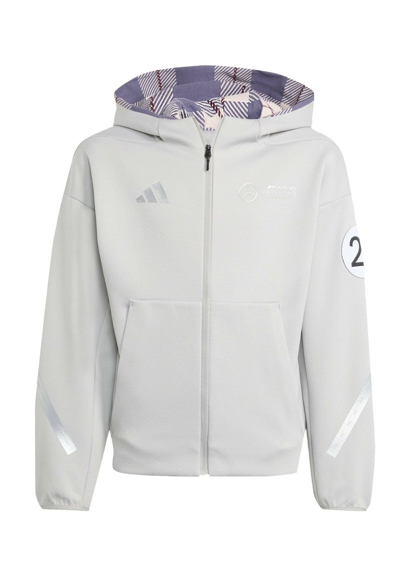 Veste à capuche grise clair avec fermeture éclair à l'avant, dotée d'une doublure intérieure à motifs, d'accents réfléchissants et de poches latérales. Comprend des détails de logo.