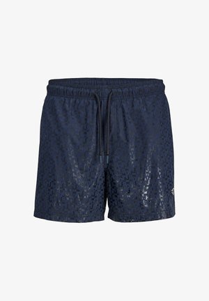 Marineblå herre badeshorts med subtilt mønster, elastisk midje og svart snor, liten logo nederst på høyre ben.