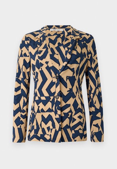 Navy blue and beige jacket with an abstract zigzag pattern, single-breasted design, notched collar, and two buttons. Soft fabric texture.