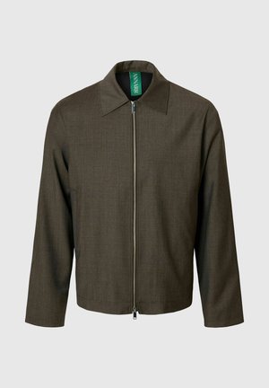 Brun ternet jakke med bred krave, lange ærmer og lynlås. Fremstillet af struktureret stof med en afslappet, kasseformet pasform.