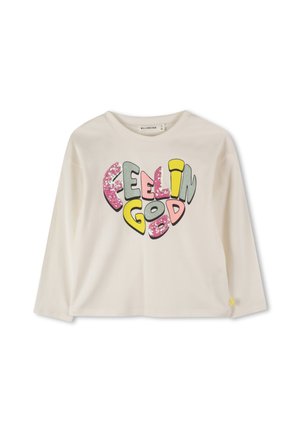 Cremefarbenes Kindershirt mit langen Ärmeln und bunten, glitzernden "Feelin Good"-Schriftzug in fetten, abgerundeten Buchstaben über der Brust.