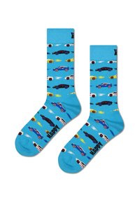 Modré bavlněné ponožky s opakujícím se vzorem barevných aut a plamenů, se slovem "ŠŤASTNÝ" v černé na spodní straně.