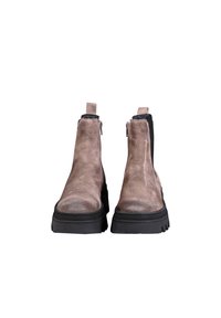 Brown suede ankle boots with a black elastic side, zipper closure, thick rubber sole, and a textured upper.