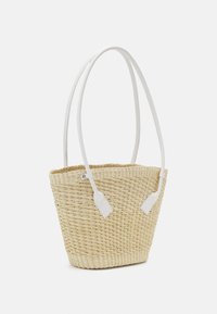 Woven straw tote bag with a natural beige color, featuring two white faux leather handles and an open top design.