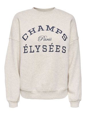 Beige crewneck sweatshirt with navy blue text "CHAMPS ÉLYSÉES" and "Paris" in smaller cursive font between the words.