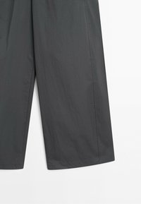 Dark gray straight-leg pants shown from mid-thigh to hem with visible side seams on a white background.