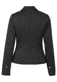 Svart figursydd jacka med slagkrage, texturerad tyg och knappdetaljer på ärmarna. Baksidan har skräddarsydda sömmar för en konturerad form.