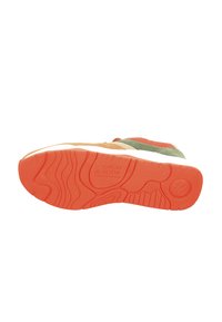 Multicolored sneaker outsole with orange rubber, textured surface, and embossed logo. Features grooves for traction and stability.