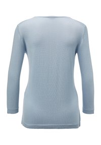 Lichtblauwe lange mouw trui van ribstof. Bevat een ronde halslijn en zijsplitten aan de zoom voor een relaxte pasvorm.