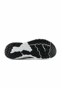 Suela de zapato con un patrón hexagonal en blanco y negro, con secciones texturizadas para un mejor agarre y flexibilidad, y forma aerodinámica para un rendimiento óptimo.