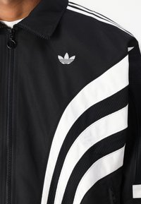 adidas Originals UNISEX - Training jacket - black/cloud white