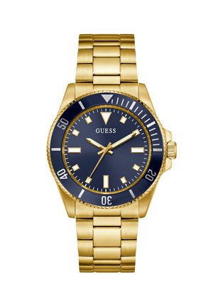 Guldfarvet rustfrit stål ur med en marineblå urskive, sølv timemarkører og et matchende ledarmbånd. Drejelig bezel og præget krone.