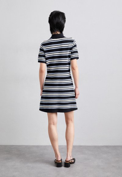 Black and white striped short dress with a fitted bodice, short sleeves, and flared skirt. The fabric appears ribbed with a smooth texture.