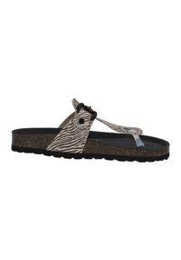 Infradito a motivo zebra con una suola in sughero scuro, dettagli neri e una strap trasparente. Presenta un design a ciabatta e una fibbia regolabile.
