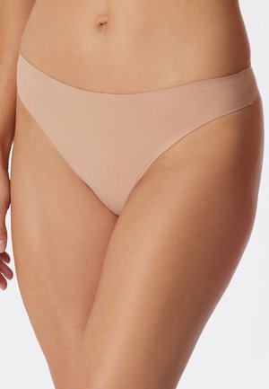 Beige seamless bikini briefs with a smooth texture and low-rise design. Features a narrow waistband and minimal rear coverage.