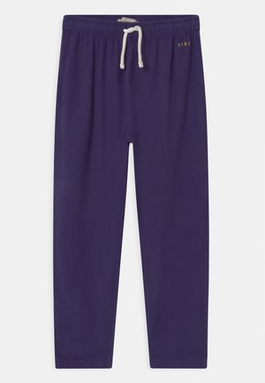 Marineblå sweatpants med elastisk talje og hvid snøre, med lille "TINY" tekst på øverste højre side.