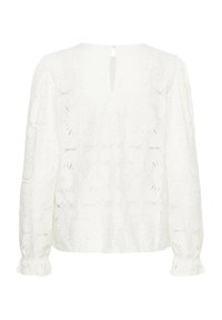 Valge pluus, millel on puhvli pikad varrukad, lilleline pitsimuster ja võtmeaugu tagakülg. Pehme, tekstureeritud kangas koos volangvarrukatega.