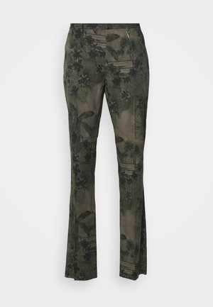 Trousers in a green and brown floral print, featuring a flared design, lightweight fabric with a textured surface, and a zip closure.