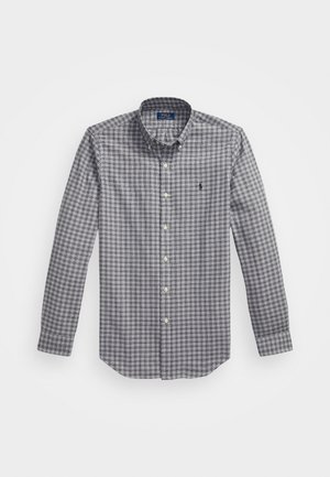Långärmad skjorta med knapp-up i grå och vit rutmönster, med knäppt krage, framsidan har knappar och en liten broderad logotyp på bröstet.