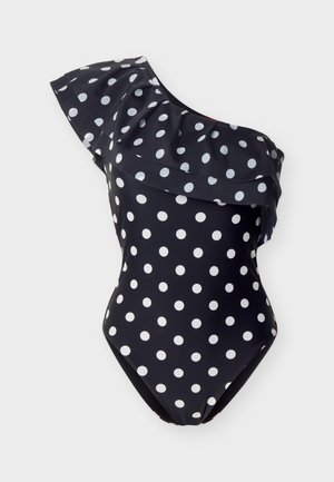 Μαύρο ολόσωμο μαγιό με έναν ώμο, λευκές βούλες και βολάν στο λαιμό και τον ώμο.