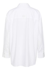 White long-sleeve shirt made of smooth fabric, featuring a classic collar, buttoned cuffs, and a subtle logo embroidered at the back.