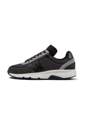 Black and gray sneaker with a mixed material design, featuring leather and suede accents, a textured sole, and lace-up closure.
