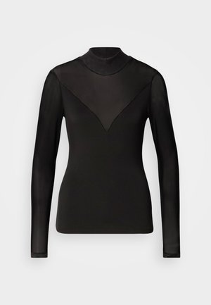Top negro de manga larga con paneles transparentes que forman una forma de V en el escote. Textura suave, diseño ajustado, cuello alto.