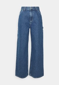 Pantaloni in denim blu a gamba larga con vita alta, cuciture a contrasto e tasche laterali, caratterizzati da un classico design a cinque tasche e orli grezzi.