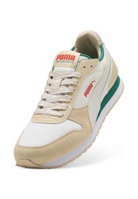 Beige suede and white mesh sneaker with green accents. Features a padded collar, textured tongue, and logo label on the tongue.