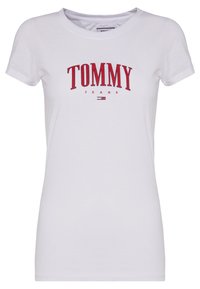 White cotton t-shirt with short sleeves, featuring red "TOMMY JEANS" text printed in a curved style across the chest. Simple design.