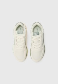 Pair of white and gray Hi-Tec sneakers with mesh and suede details, viewed from above on a white background.