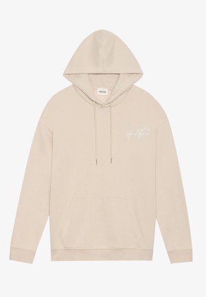 Felpa beige con cappuccio, tasca frontale e lacci, con piccolo testo bianco in corsivo sulla parte sinistra del petto.