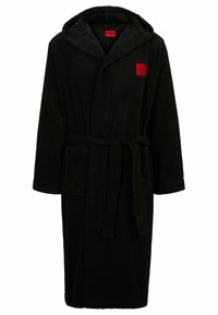 Black hooded bathrobe made of soft terry cloth, featuring a front tie belt and a small red logo patch on the chest, with two side pockets.