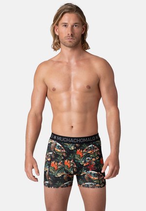 Men's boxer briefs in black with a vibrant tropical print featuring turtles and flowers. Soft fabric, elastic waistband with logo.