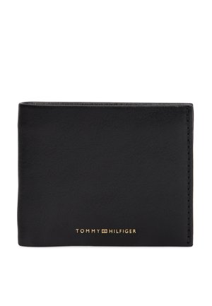 Sort læderpung med syninger langs kanterne og et gyldent Tommy Hilfiger-logo centreret foran.