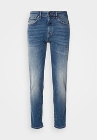 Blue denim jeans featuring a straight leg design, light fading, classic five-pocket styling, and a zip fly with button closure.