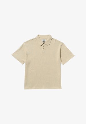 Beige polo shirt gemaakt van zachte stof, met een subtiel loofpatroon, drieknoopsluiting en een klassieke kraag. Korte mouwen.