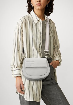 Light gray leather crossbody bag with a rounded shape, embossed logo, and a multicolored striped adjustable strap. Textured surface detail.